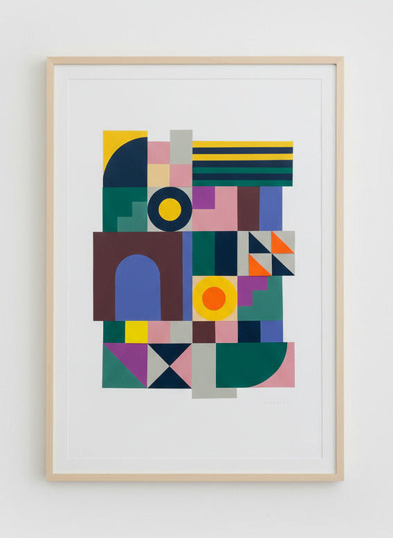 Framed abstract artwork with geometric shapes on a white wall